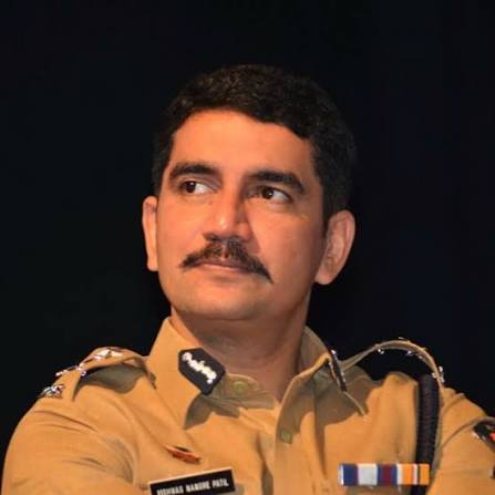 Vishwas Nangre Patil in uniform, seen in three-quarter profile against a dark background
